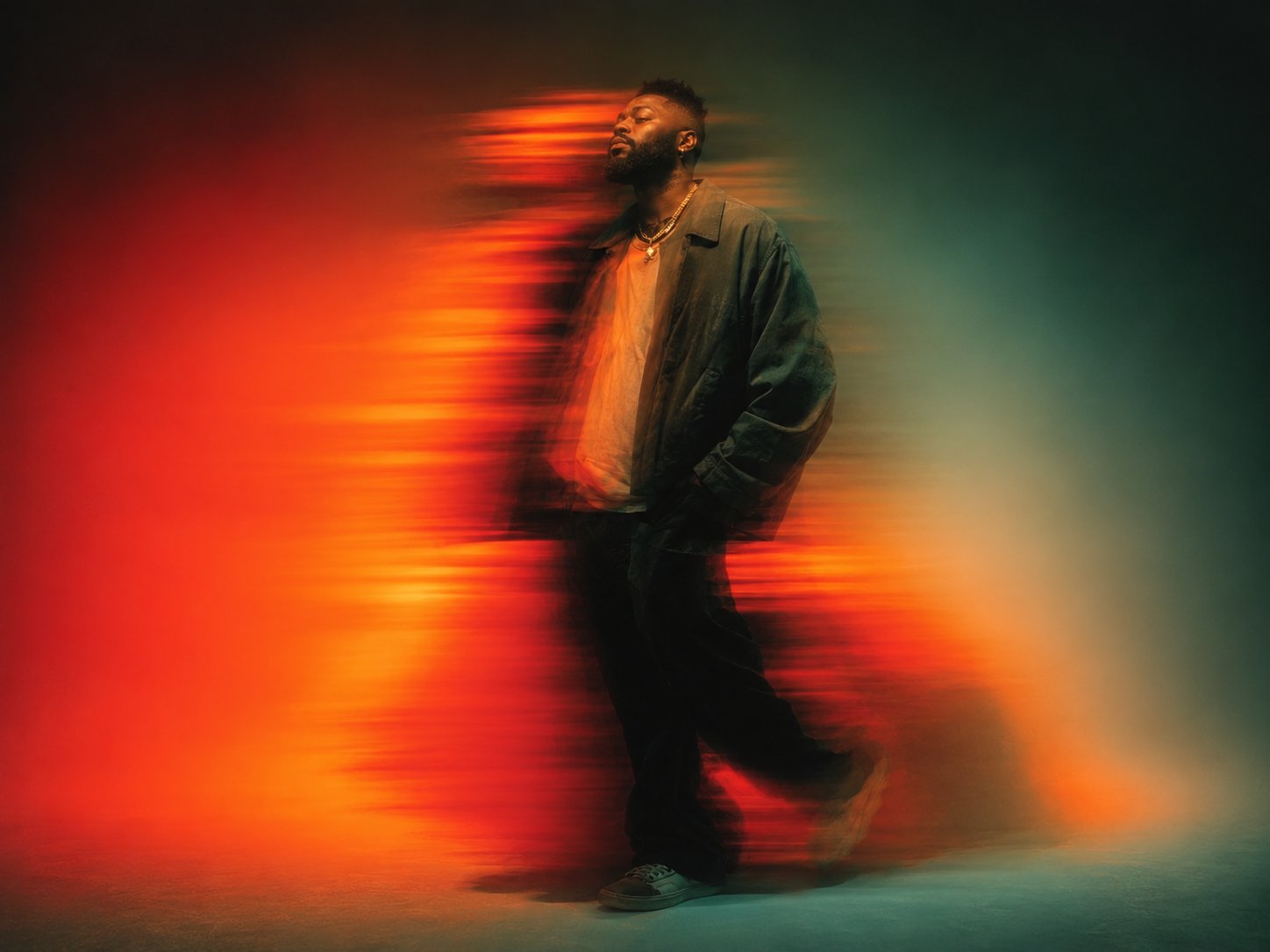 King of Men in motion against a red and teal light blur